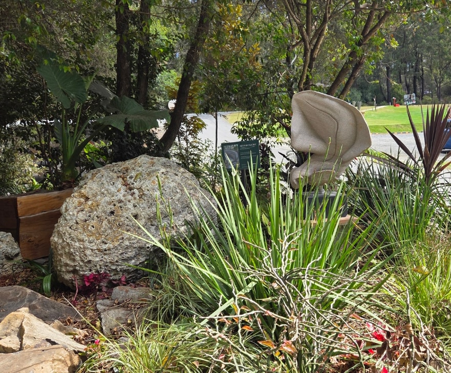 Orchid Dreaming, a carved stone sculpture by Antone Bruinsma